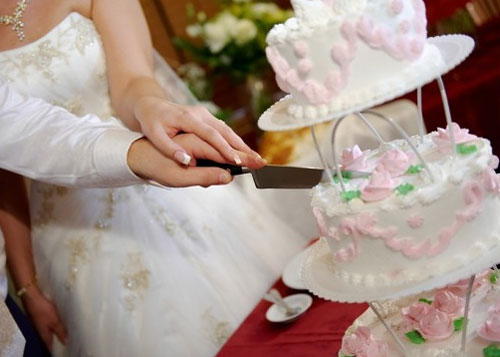 the cutting of the wedding cake